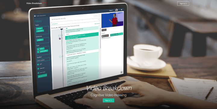Photo of laptop with overlaid text: Video Breakdown. Cognitive Video Indexing